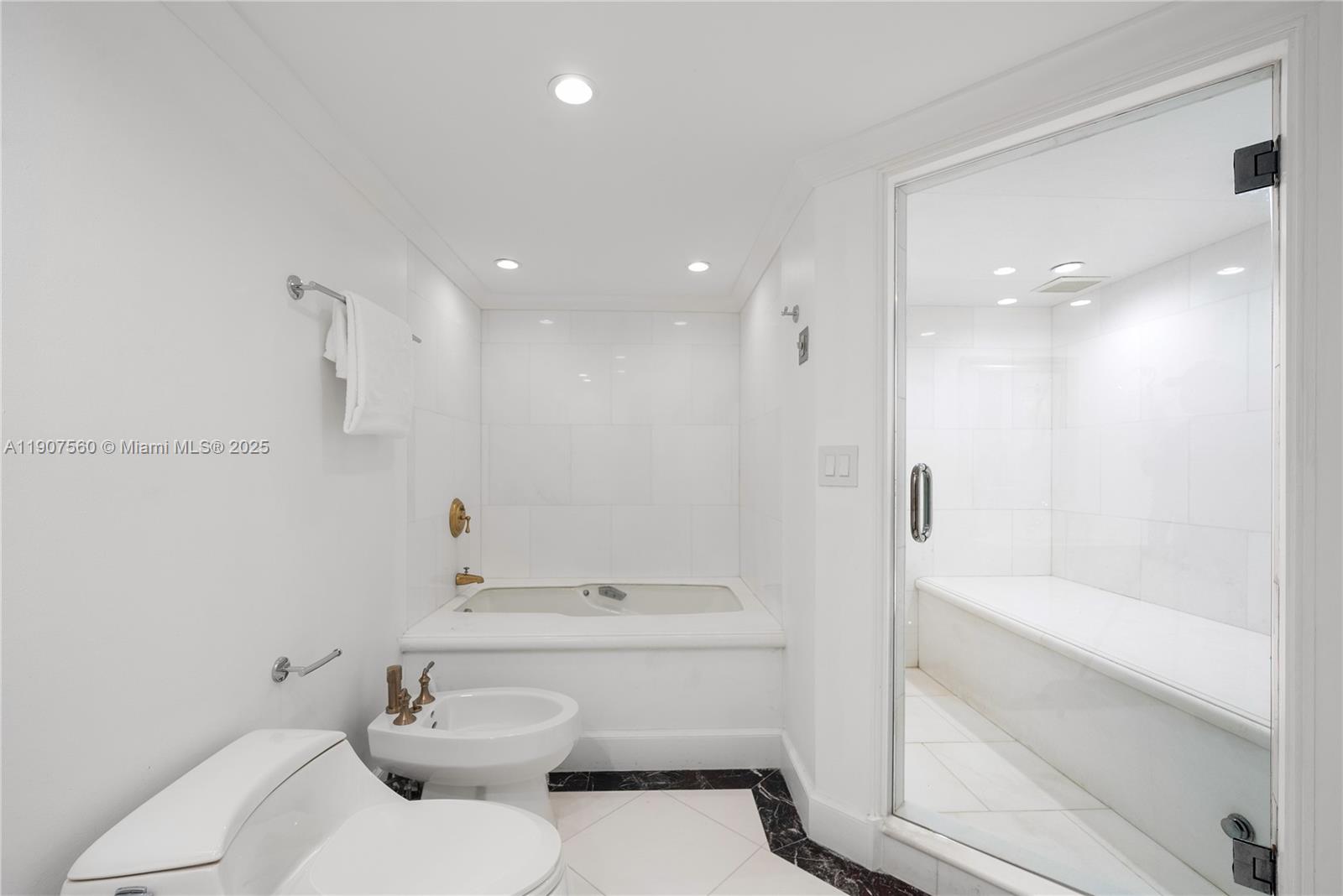 1925 Brickell Avenue, Unit DPH3 Miami, FL 33129 - Photo 44 of 56 a bathroom with a sink a toilet and shower