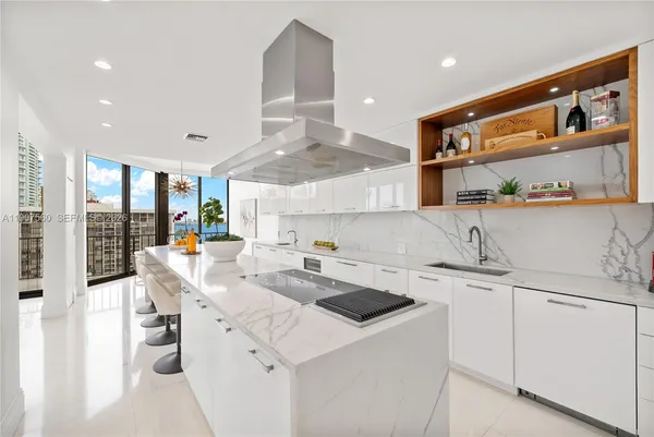 a kitchen with a sink and appliances