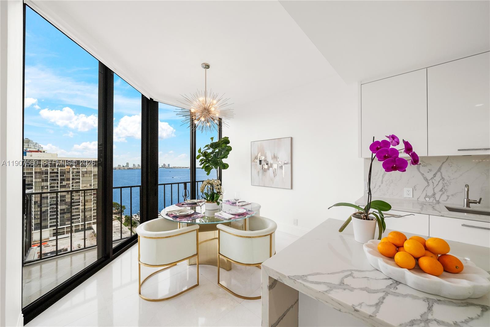 1925 Brickell Avenue, Unit DPH3 Miami, FL 33129 - Photo 10 of 56 a dining room with furniture and a floor to ceiling window