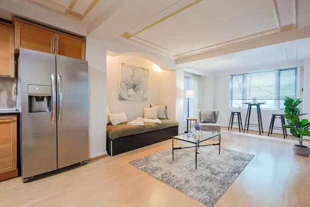 a living room with furniture and a rug