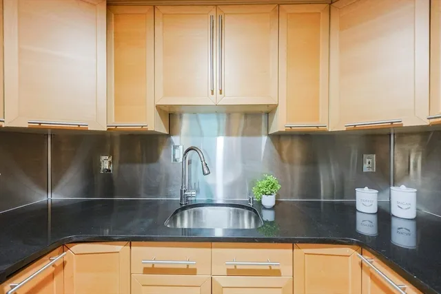 a kitchen with a sink and a window