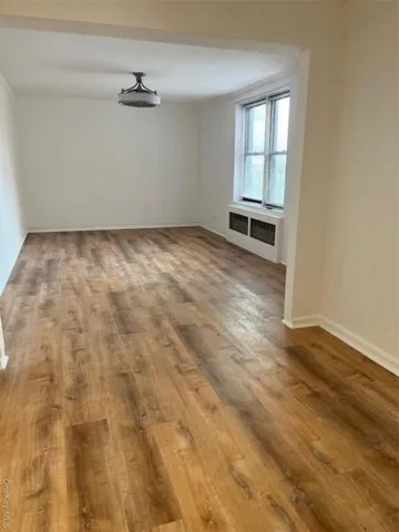 a view of storage and utility room with two washing machine