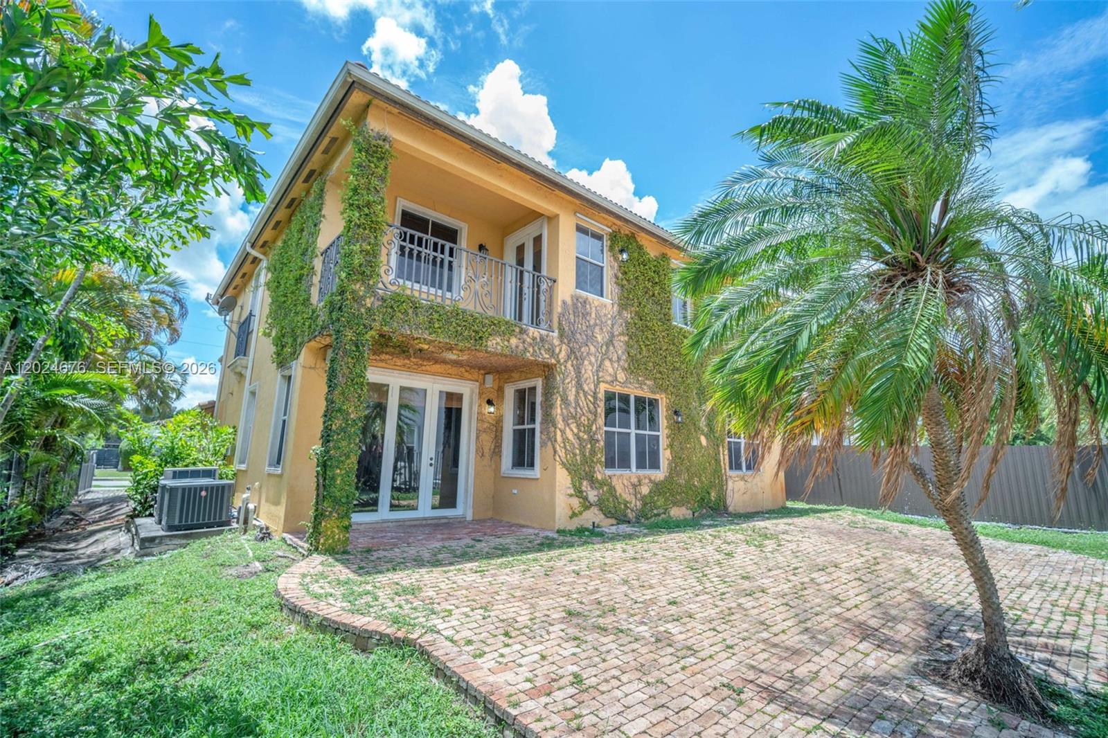 2155 Southwest 156th Court Miami, FL 33185 - Photo 52 of 57 a view of a house with a yard and potted plants