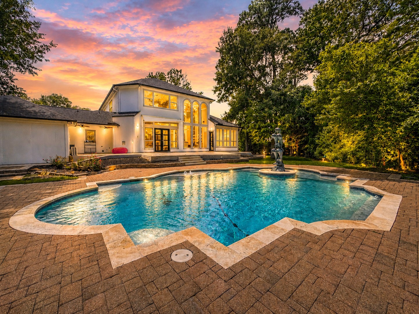 1810 Woerner Road Houston, TX 77090 - Photo 1 of 39 Experience luxury living with this stunning home, featuring a sparkling pool and elegant design. Perfectly nestled in nature, it offers serene privacy and breathtaking views at dusk.