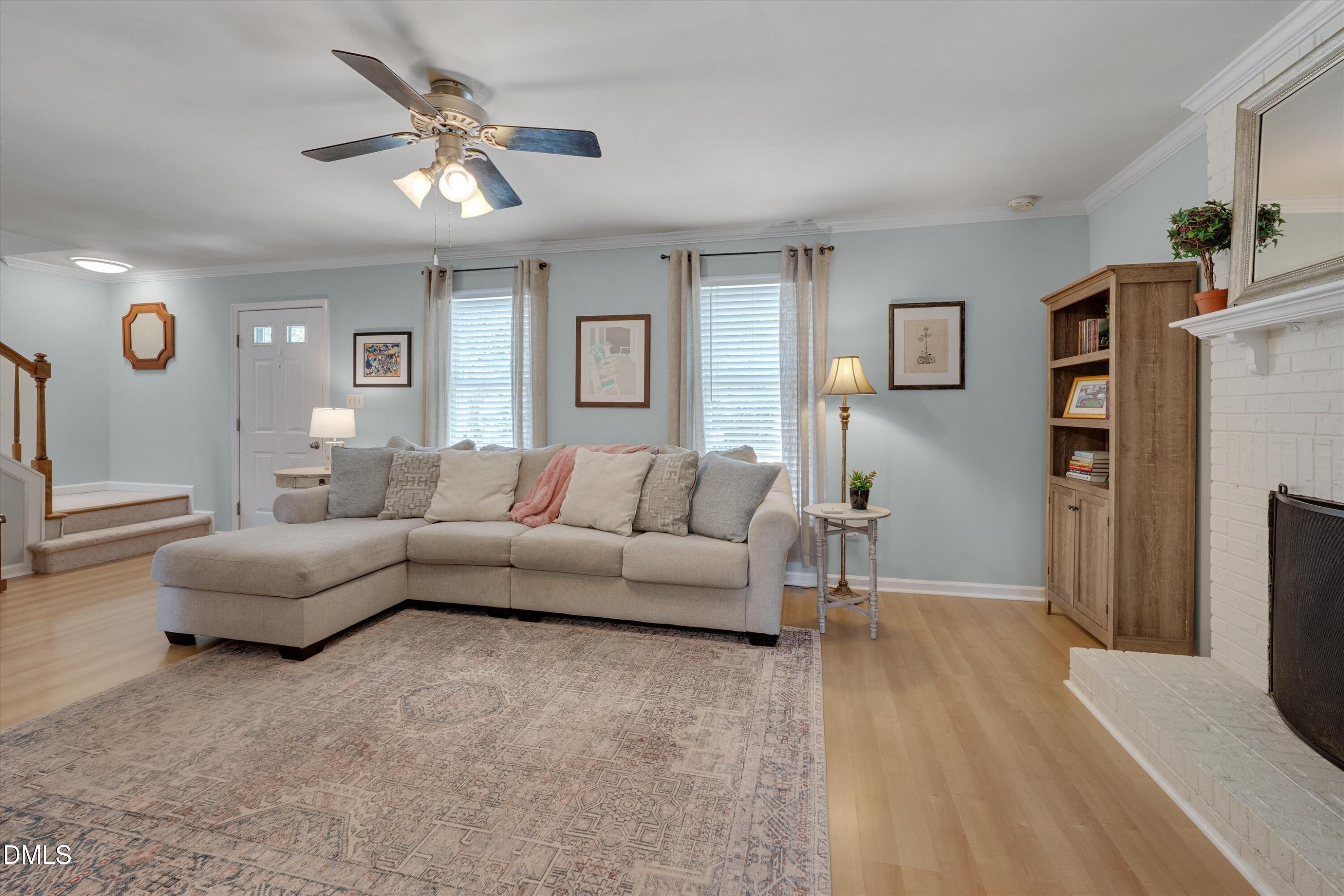 3301 Lassiter Street Durham, NC 27707 - Photo 6 of 32 a living room with furniture and a flat screen tv