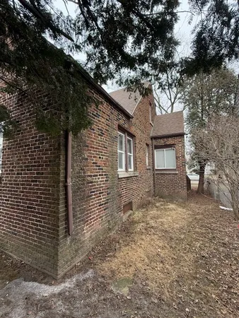 a front view of a house with parking space