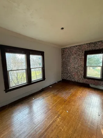 an empty room with windows