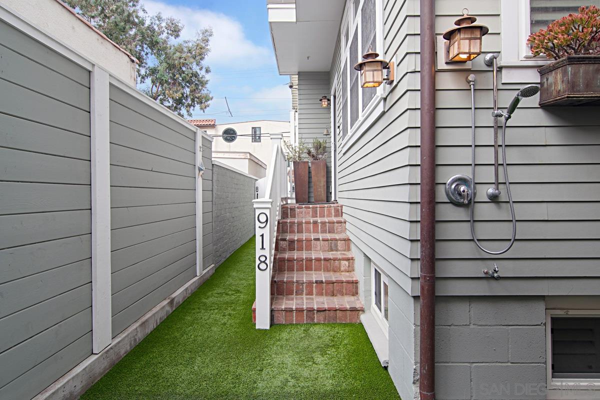 918 D Avenue Coronado, CA 92118 - Photo 2 of 41 a view of a pathway of a house with a yard