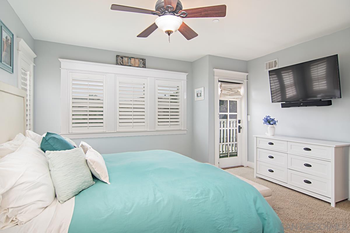 918 D Avenue Coronado, CA 92118 - Photo 22 of 41 a bedroom with a bed a flat screen tv and a window