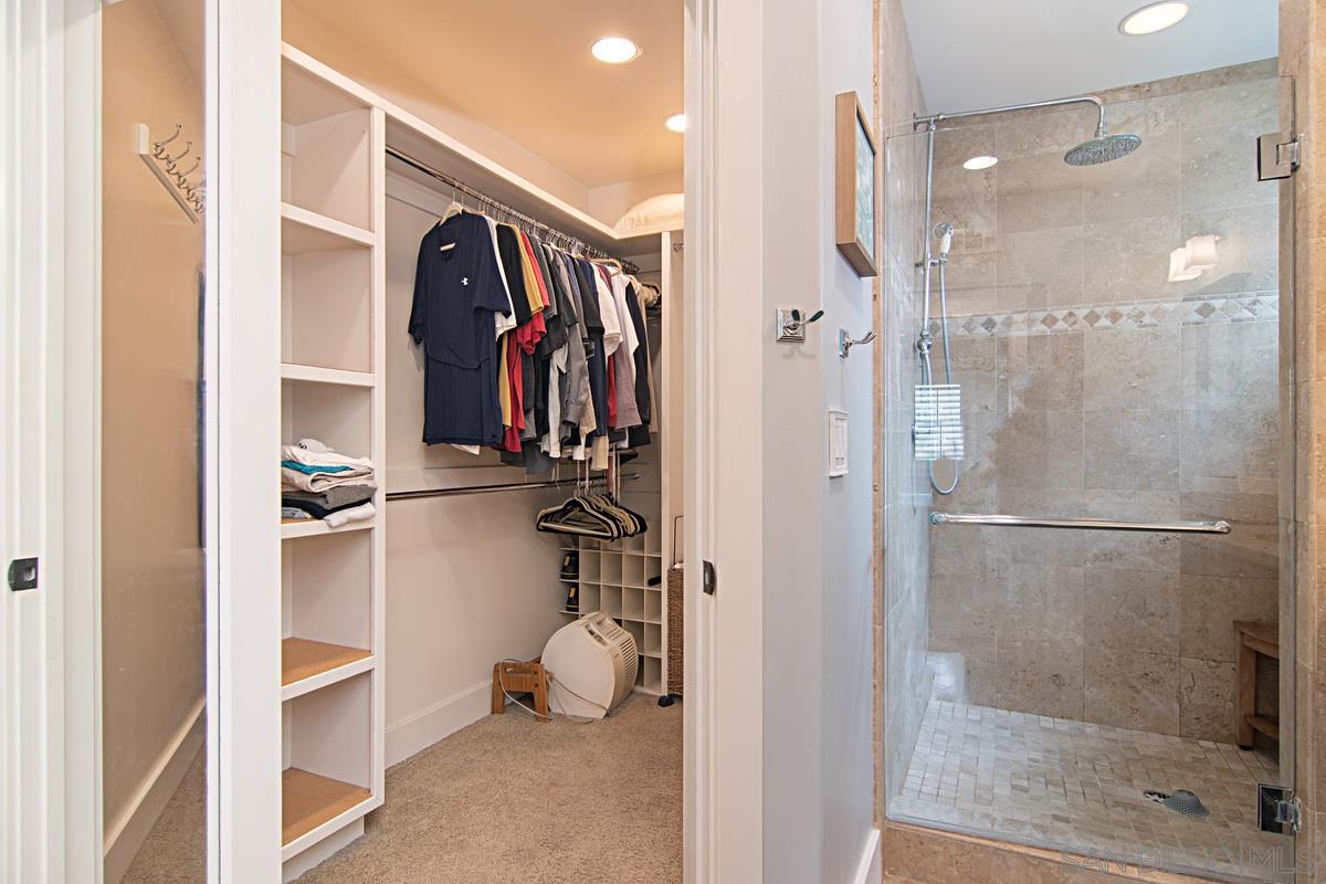 918 D Avenue Coronado, CA 92118 - Photo 24 of 41 a view of walk in closet with clothes and shoes