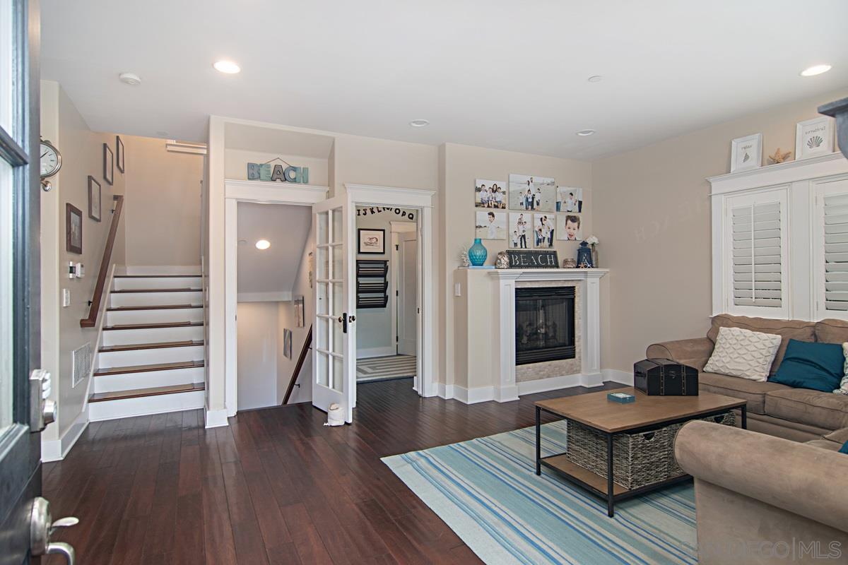 918 D Avenue Coronado, CA 92118 - Photo 4 of 41 a living room with furniture fireplace and wooden floor