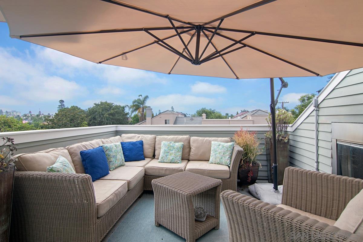 918 D Avenue Coronado, CA 92118 - Photo 32 of 41 a roof deck with couches and potted plants
