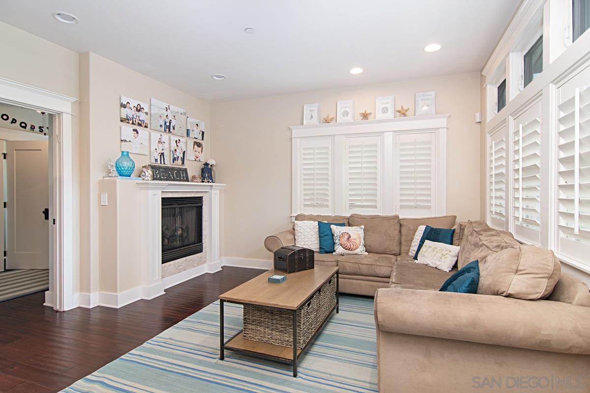 918 D Avenue Coronado, CA 92118 - Photo 5 of 41 a living room with furniture and a fireplace