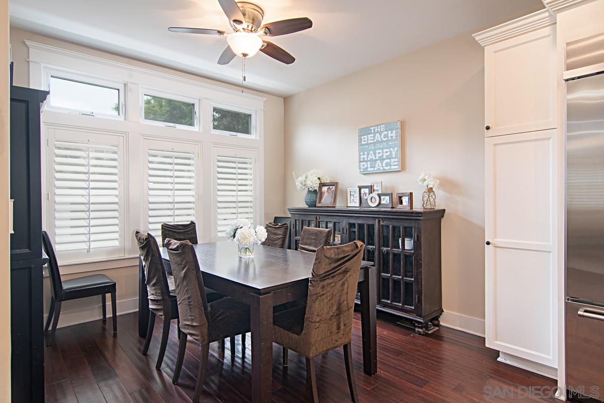 918 D Avenue Coronado, CA 92118 - Photo 8 of 41 a view of a dining room with furniture and wooden floor
