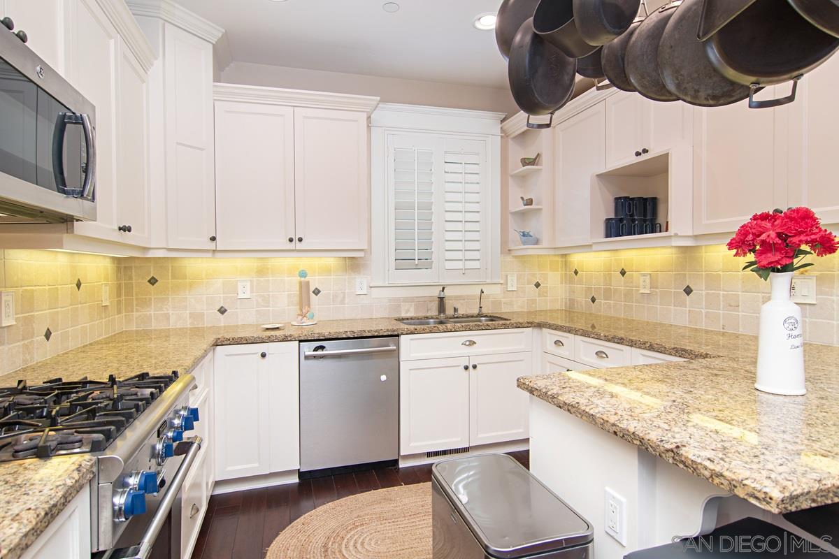 918 D Avenue Coronado, CA 92118 - Photo 10 of 41 a kitchen with a sink stove and cabinets