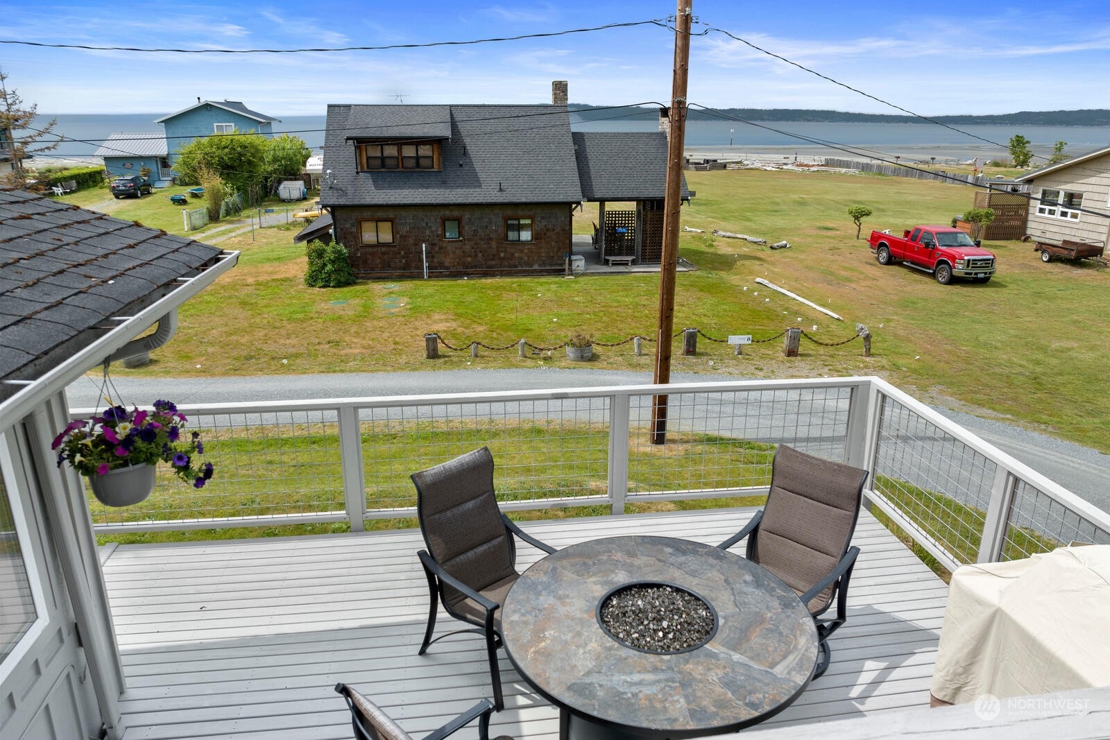 7524 Maxwelton Road Clinton, WA 98236 - Photo 11 of 30 a view of a chairs and table in the balcony