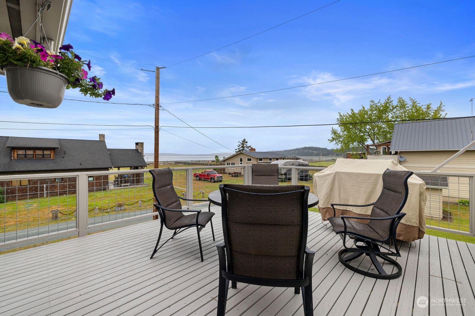 7524 Maxwelton Road Clinton, WA 98236 - Photo 12 of 30 a view of a dining room with furniture and wooden floor