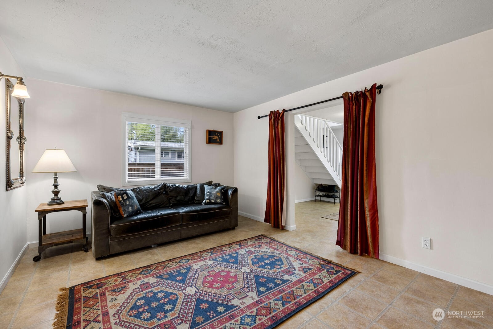 7524 Maxwelton Road Clinton, WA 98236 - Photo 20 of 30 a living room with furniture and a rug