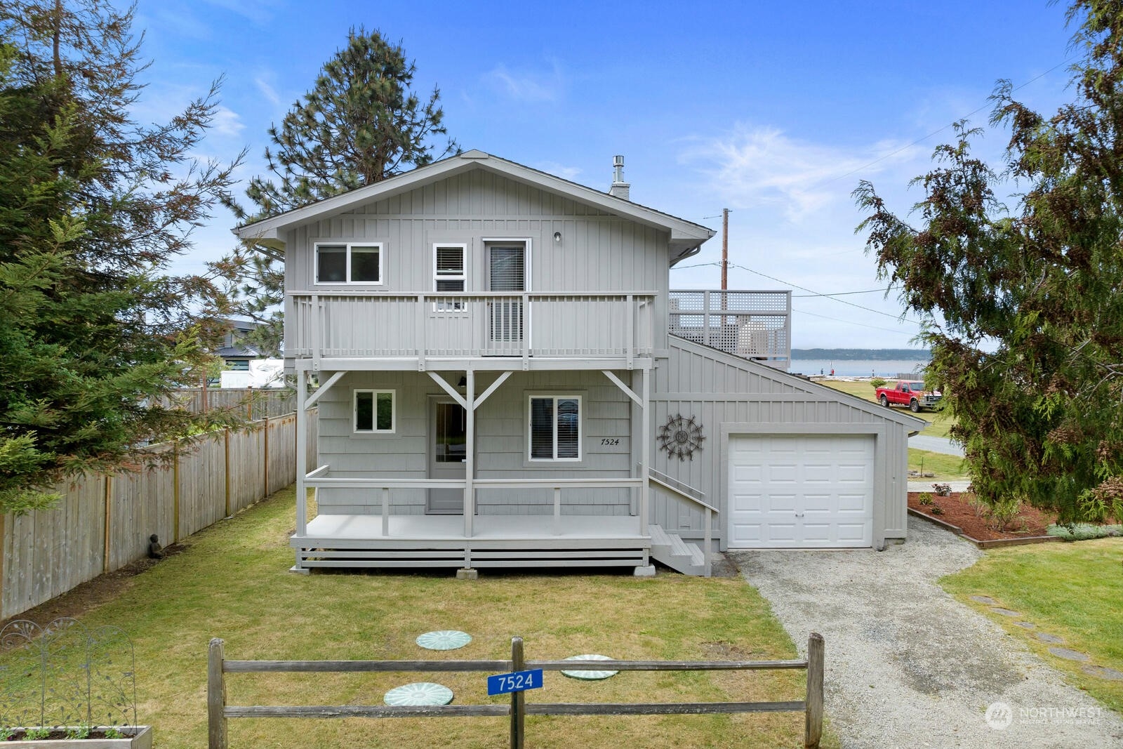7524 Maxwelton Road Clinton, WA 98236 - Photo 2 of 30 a front view of a house with a yard