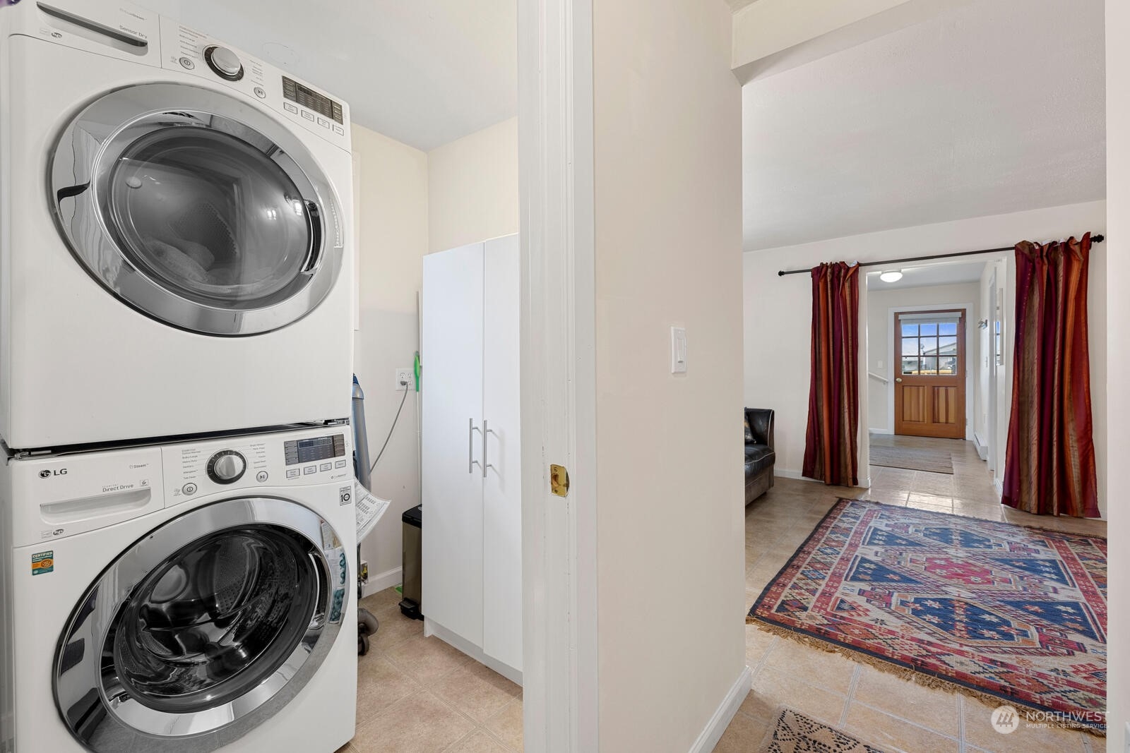 7524 Maxwelton Road Clinton, WA 98236 - Photo 24 of 30 a view of a hallway with washer and dryer