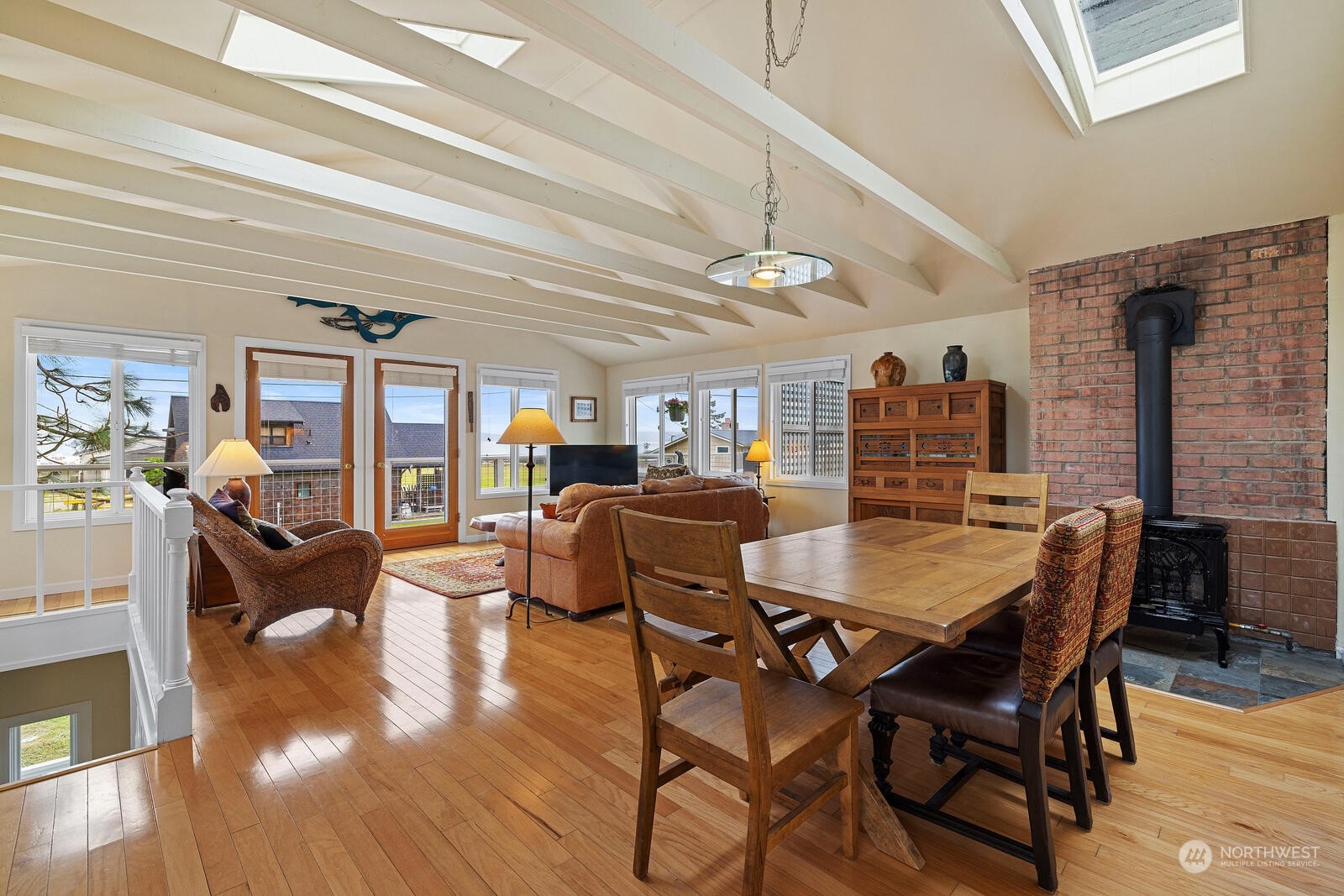 7524 Maxwelton Road Clinton, WA 98236 - Photo 5 of 30 a view of a dining room with furniture and wooden floor