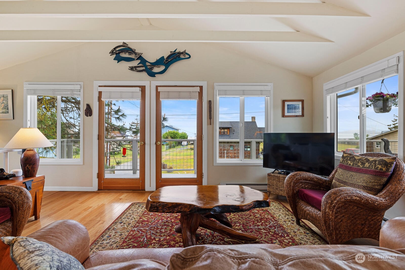 7524 Maxwelton Road Clinton, WA 98236 - Photo 6 of 30 a living room with furniture and a flat screen tv