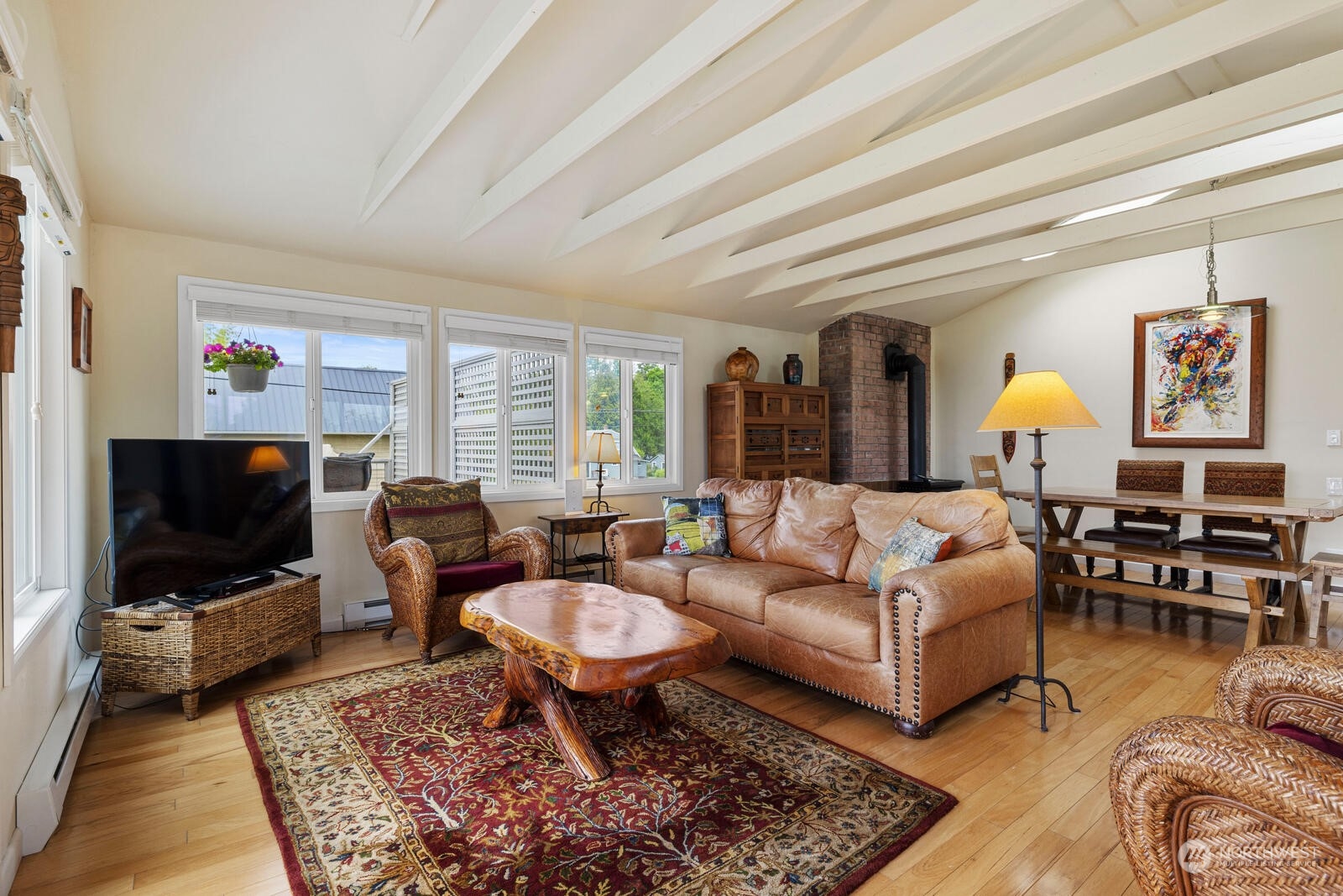 7524 Maxwelton Road Clinton, WA 98236 - Photo 9 of 30 a living room with furniture a rug and a flat screen tv