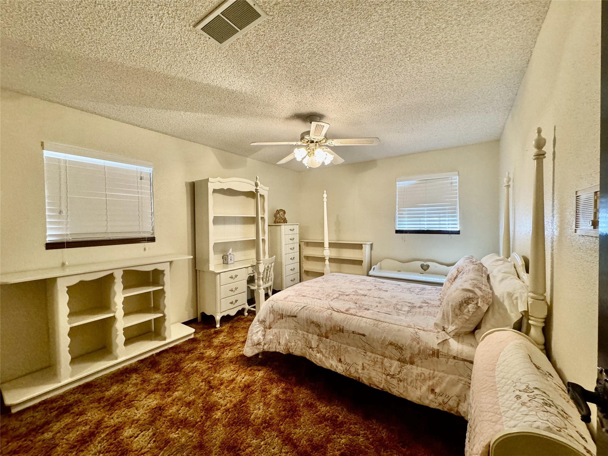 11586 Midway Road Cleveland, TX 77328 - Photo 11 of 37 a bedroom with a bed and a flat screen tv