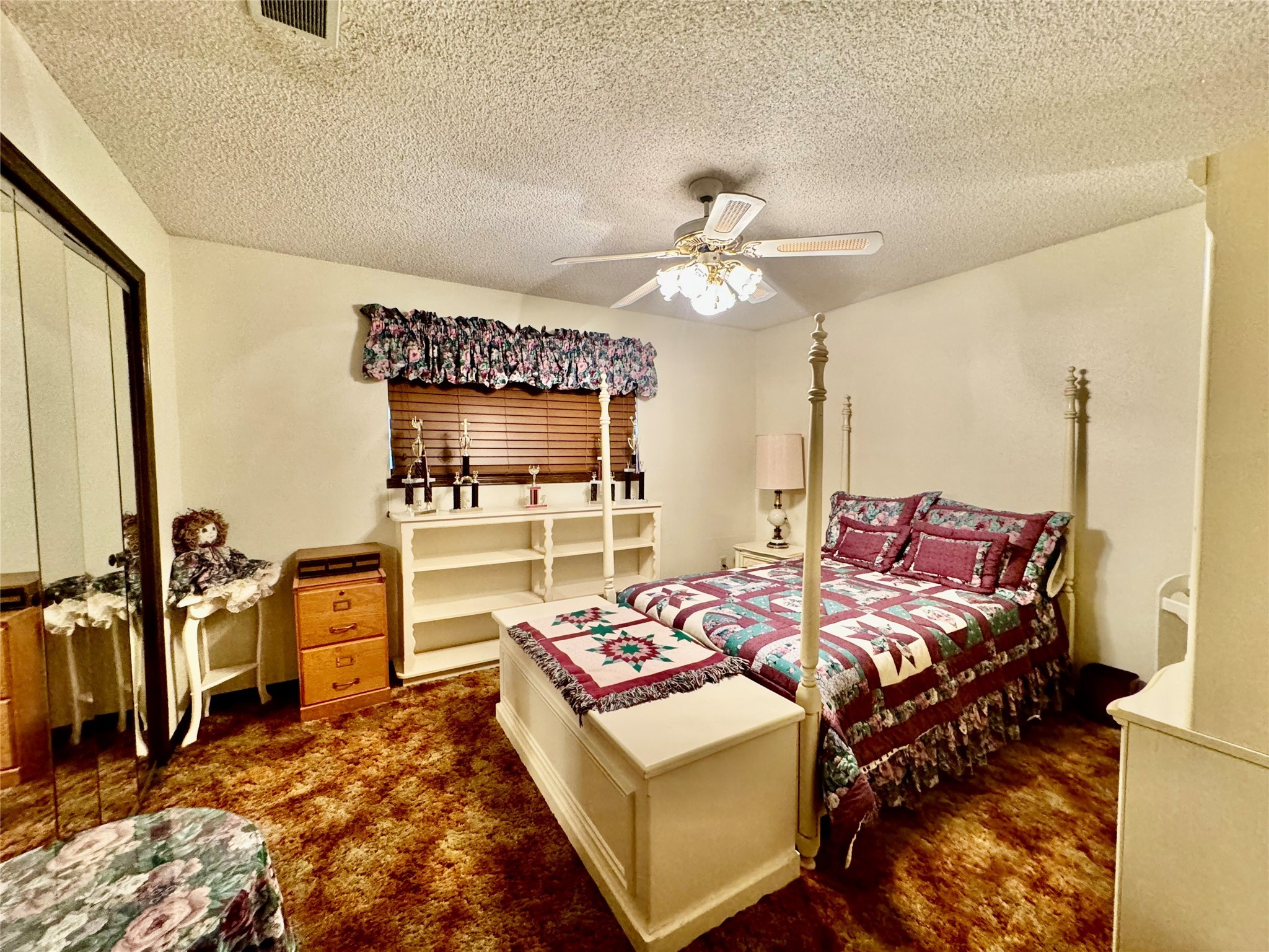 11586 Midway Road Cleveland, TX 77328 - Photo 12 of 37 a bed room with a bed mirror and a chair