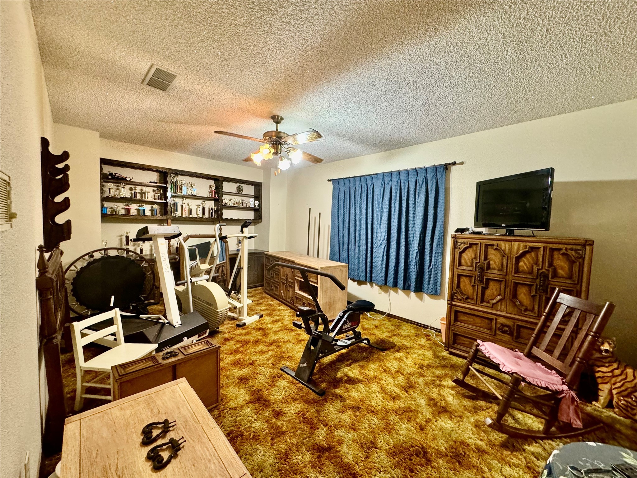 11586 Midway Road Cleveland, TX 77328 - Photo 13 of 37 a view of a room with gym equipment