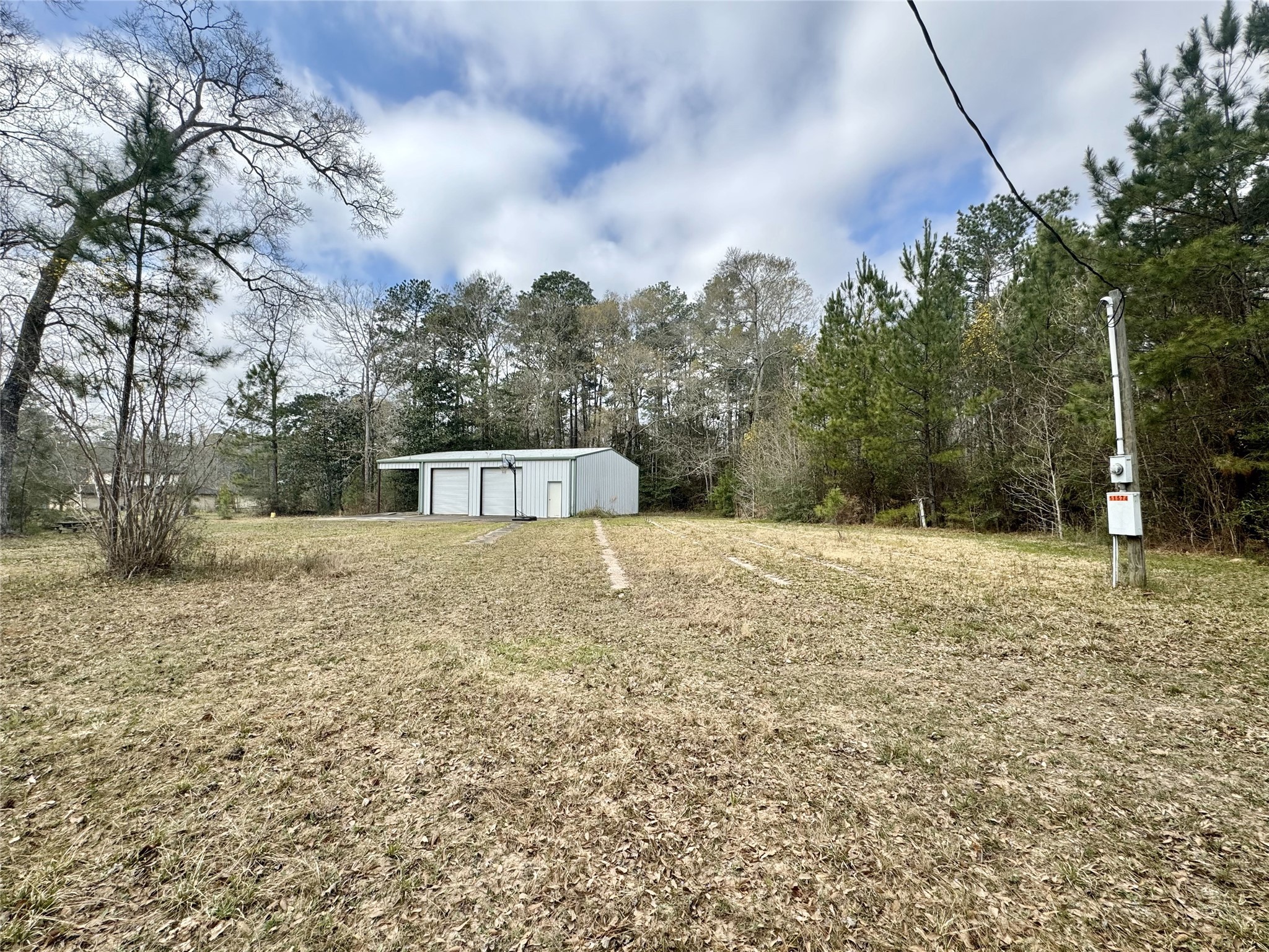 11586 Midway Road Cleveland, TX 77328 - Photo 16 of 37 a house with trees in the background