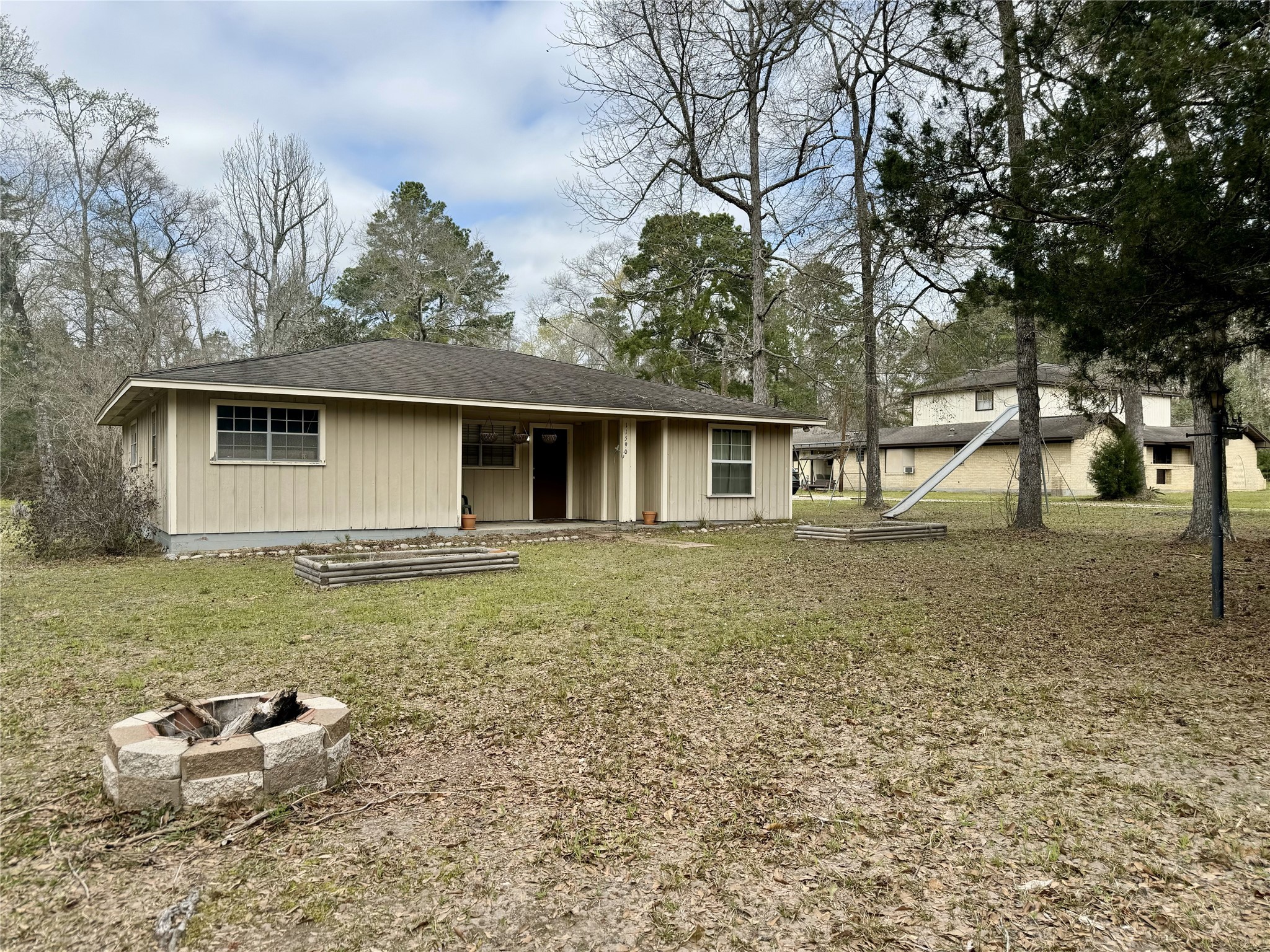 11586 Midway Road Cleveland, TX 77328 - Photo 2 of 37 a backyard of a house with table and chairs