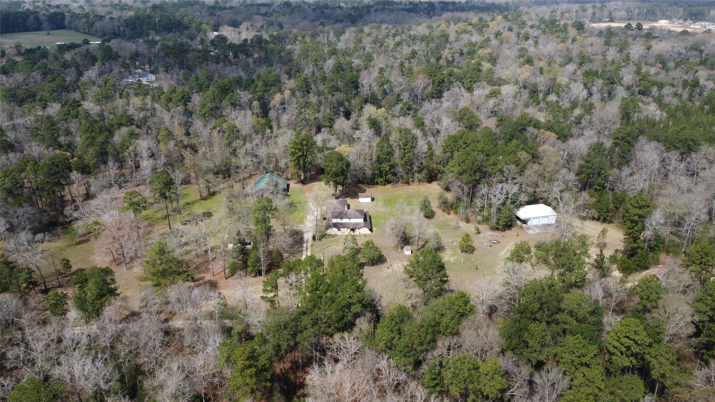 11586 Midway Road Cleveland, TX 77328 - Photo 34 of 37 a view of a forest with a house and forest