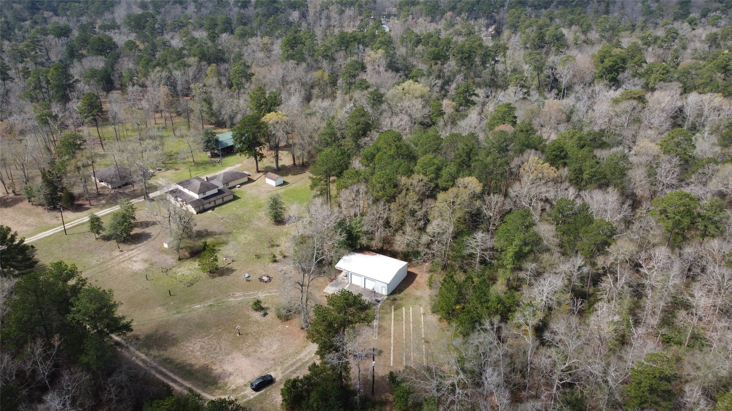 11586 Midway Road Cleveland, TX 77328 - Photo 37 of 37 an aerial view of a house with a yard