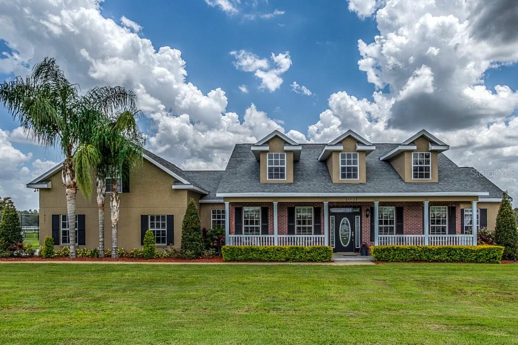 18501 Lithia Towne Road Lithia, FL 33547 - Photo 1 of 1 Exterior Front on 4.68 acres with a fully fanced yard, perfect for horses and livestock.