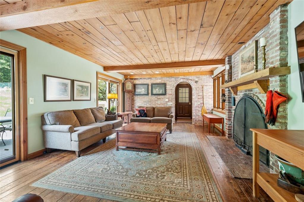 2375 Fairhill Farms Road Sewickley, PA 15143 - Photo 11 of 25 a living room with fireplace furniture and a rug