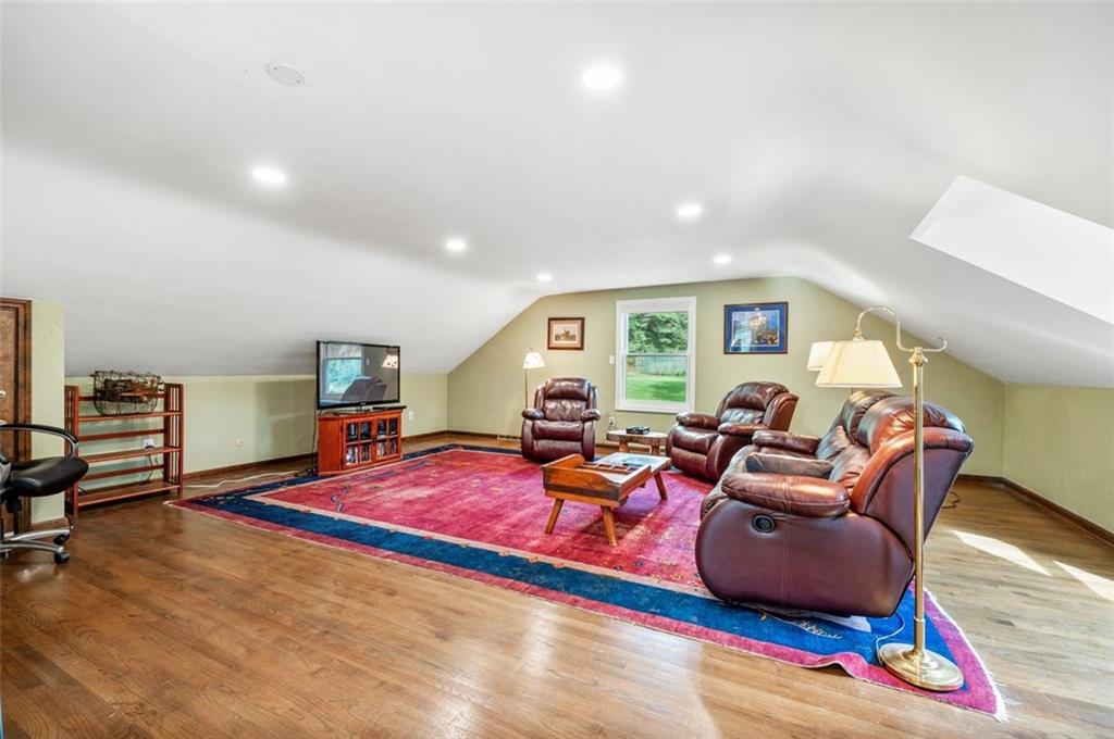 2375 Fairhill Farms Road Sewickley, PA 15143 - Photo 18 of 25 a living room with furniture a rug and a window