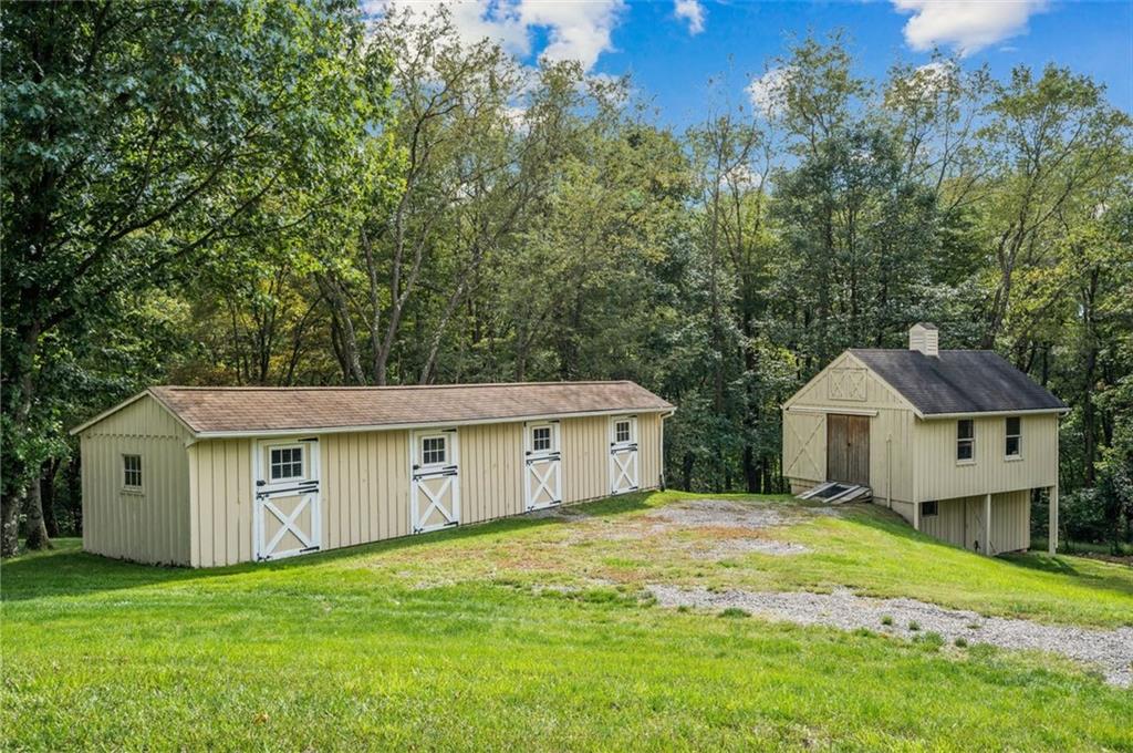 2375 Fairhill Farms Road Sewickley, PA 15143 - Photo 23 of 25 a view of a house with a big yard and large trees
