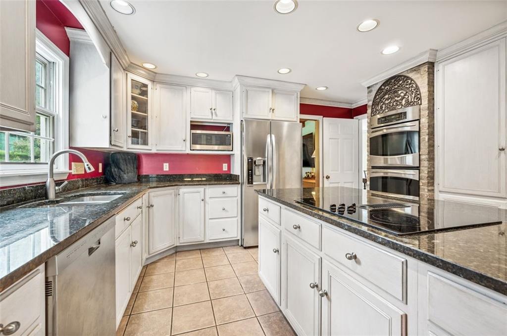 2375 Fairhill Farms Road Sewickley, PA 15143 - Photo 7 of 25 a kitchen with stainless steel appliances granite countertop a sink and cabinets