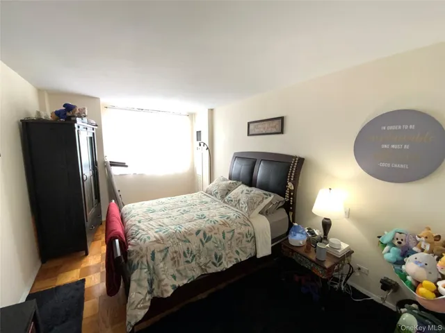 a bedroom with bed and a closet