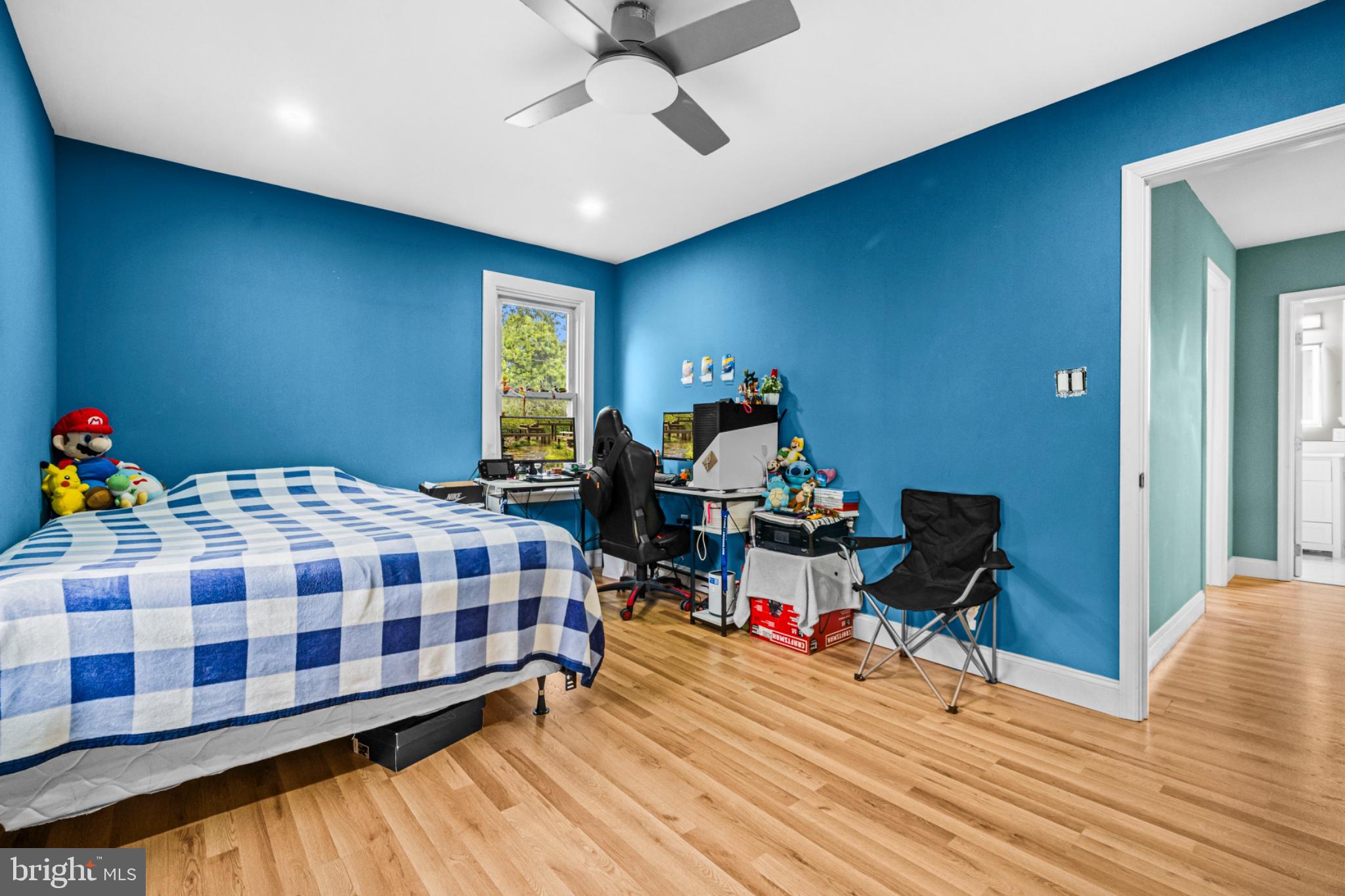 46 Boone Street Cumberland, MD 21502 - Photo 18 of 35 Vibrant blue room with cozy charm.