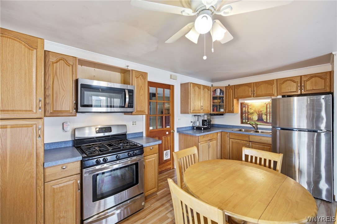 3323 New Road Wilson, NY 14131 - Photo 5 of 25 Plenty of cupboards, pantry, and newer fridge and