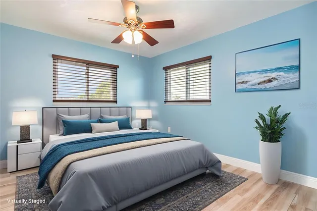 a bedroom with bed and a chandelier