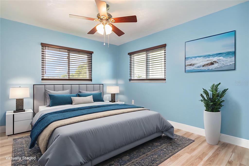 5108 Commonwealth Road Palmetto, FL 34221 - Photo 11 of 31 a bedroom with bed and a chandelier