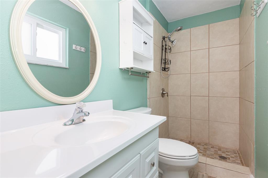 5108 Commonwealth Road Palmetto, FL 34221 - Photo 16 of 31 a bathroom with a sink toilet and shower