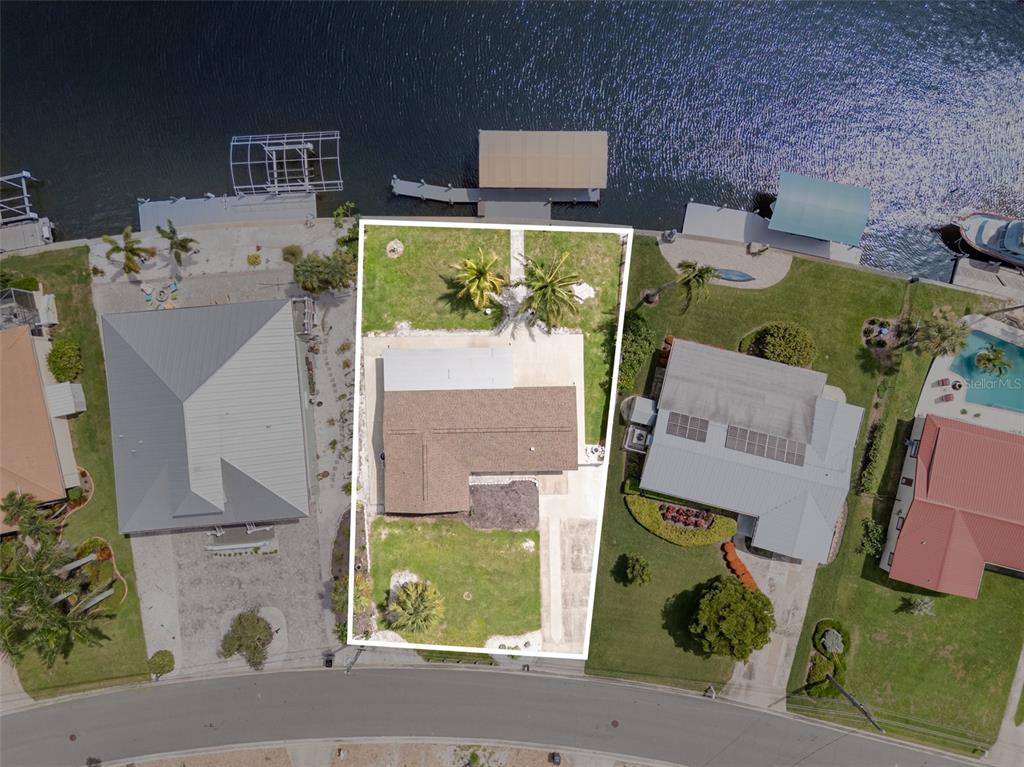 5108 Commonwealth Road Palmetto, FL 34221 - Photo 26 of 31 an aerial view of residential houses with outdoor space and parking