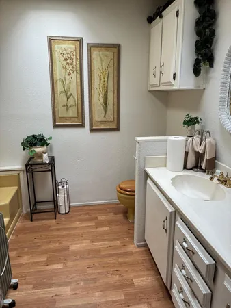 a view of a dining room with furniture wooden floor and a floor to ceiling window