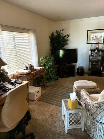 a living room with furniture and a table