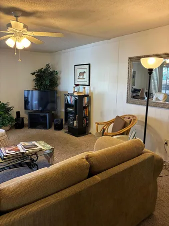 a kitchen with a wooden floor and a stove top oven