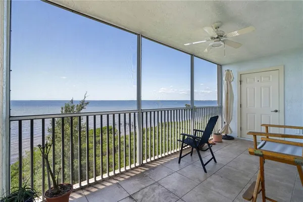 a view of a balcony with chairs